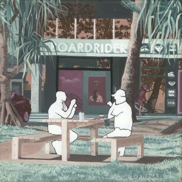 Two men sitting at a bench in front of a surf shop in Coolangatta